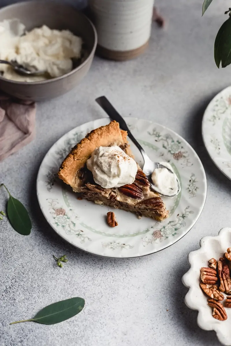 keto pecan pie on a plate with whipped cream