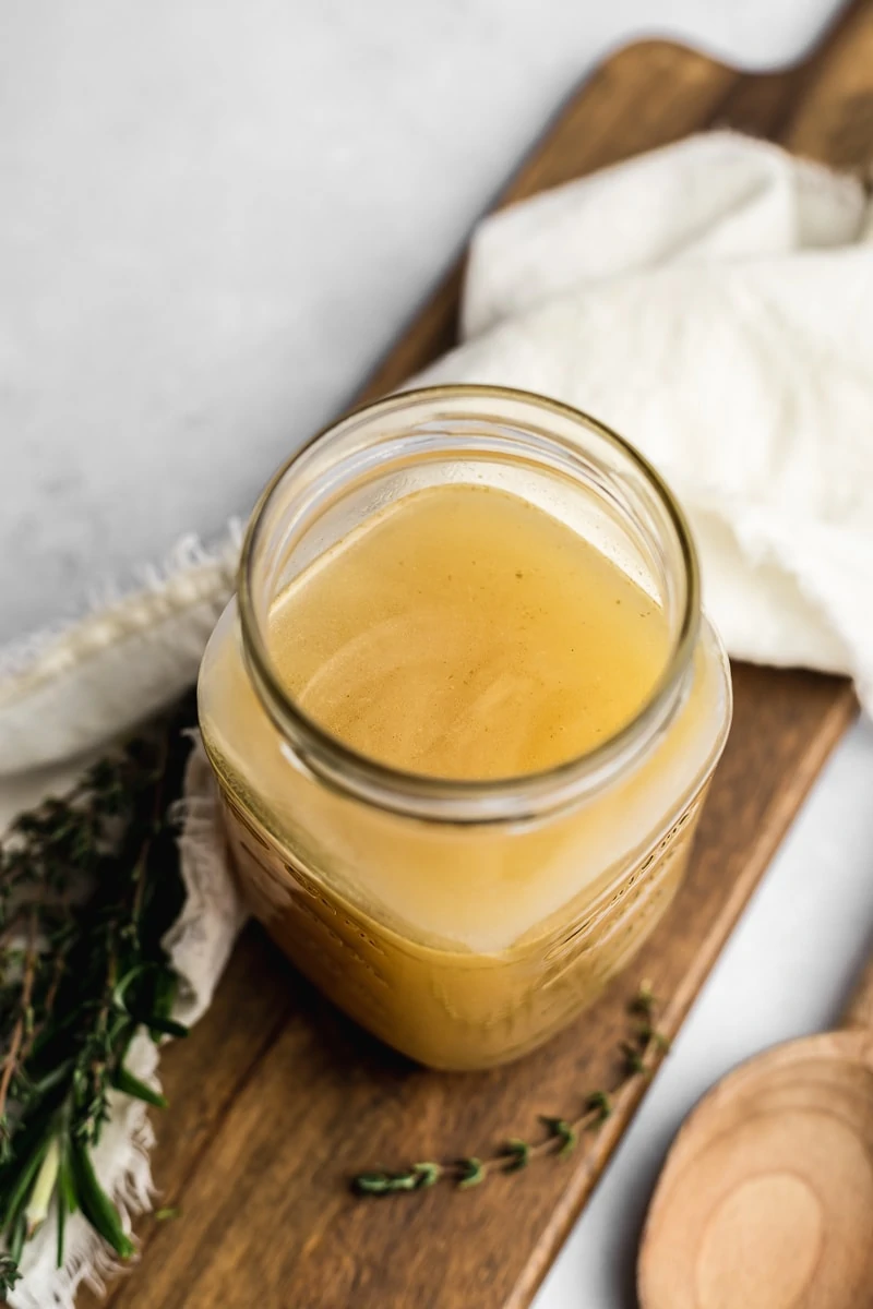 closeup of chicken bone broth in a jar