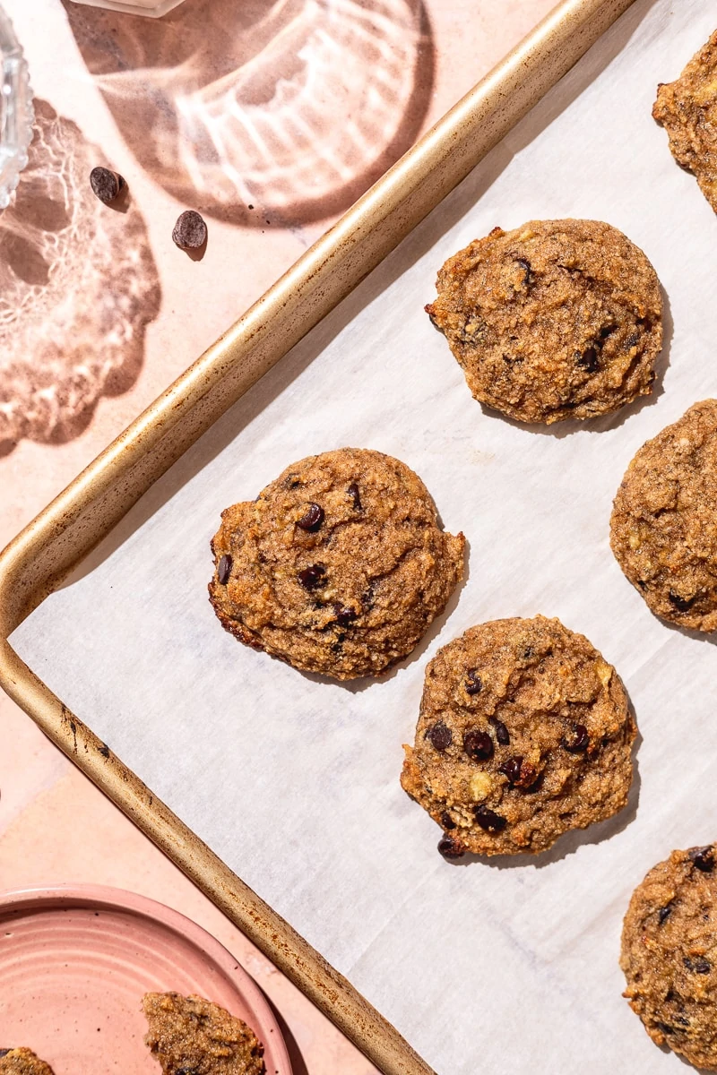 healthy banana cookies on a gold baking tray