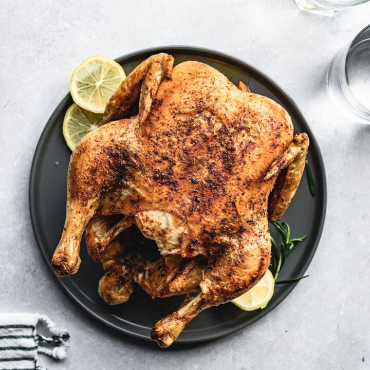 whole chicken in air fryer with water glasses