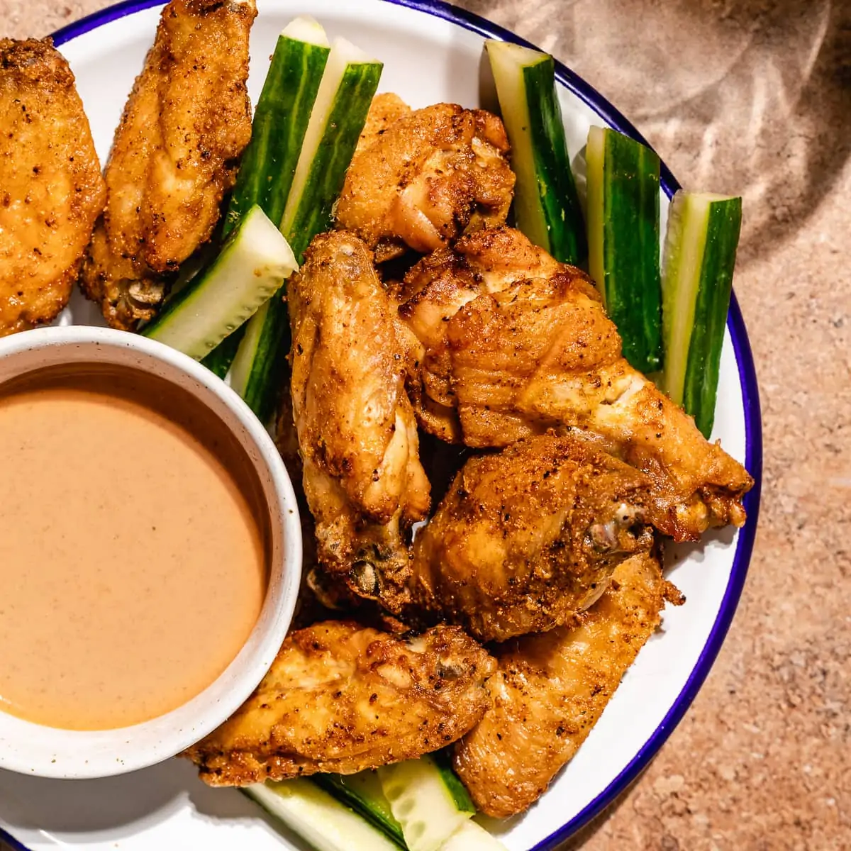 Crispy Air Fryer Chicken Wings Recipe - Shown on two racks in the air fryer  oven