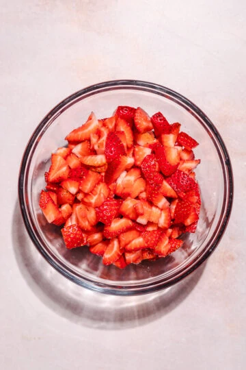 Chopped strawberries in a bowl for keto jam recipe.