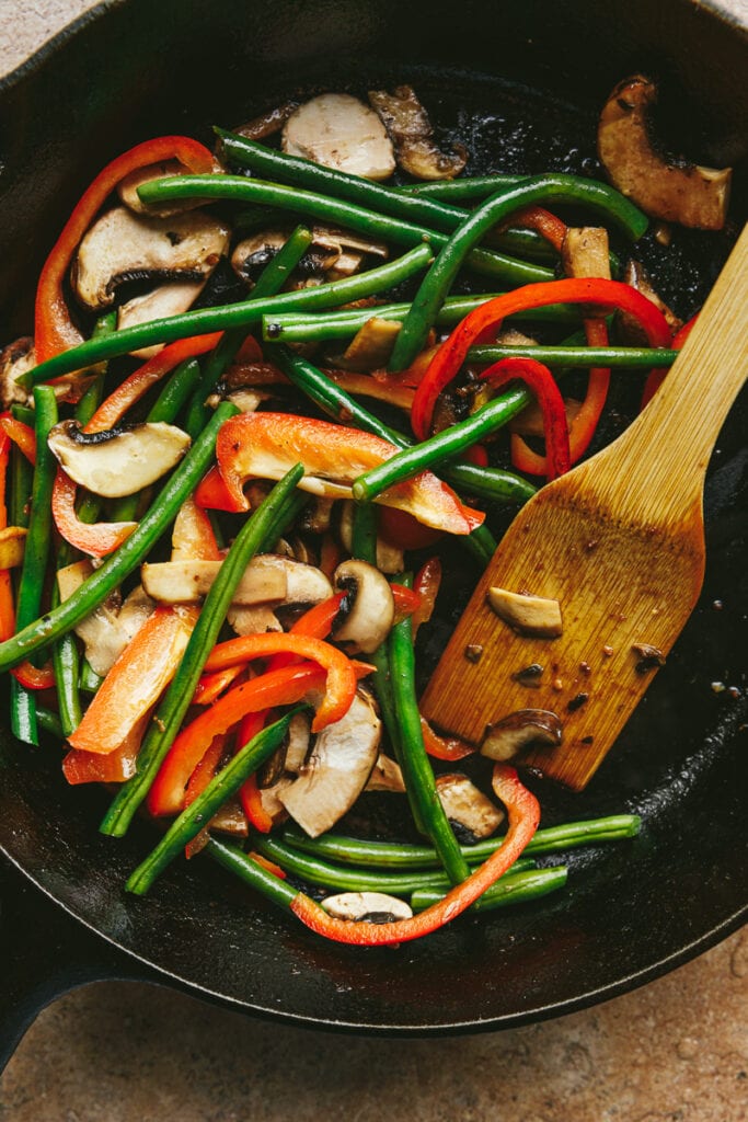 Vegetables in a skillet for chicken and steak stir fry recipe.