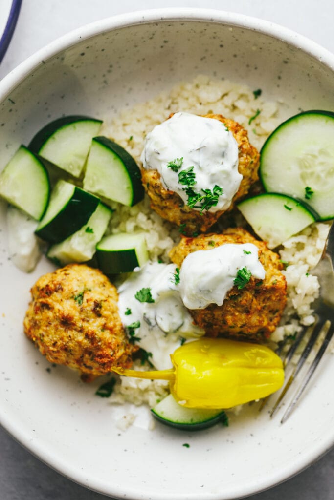 Overhead image of air fryer chicken meatballs, a high protein keto recipes.
