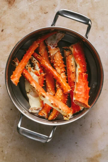 King crab legs in a pot.