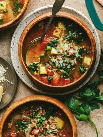 Closeup of bowls of keto Tuscan soup with beef and veggies.