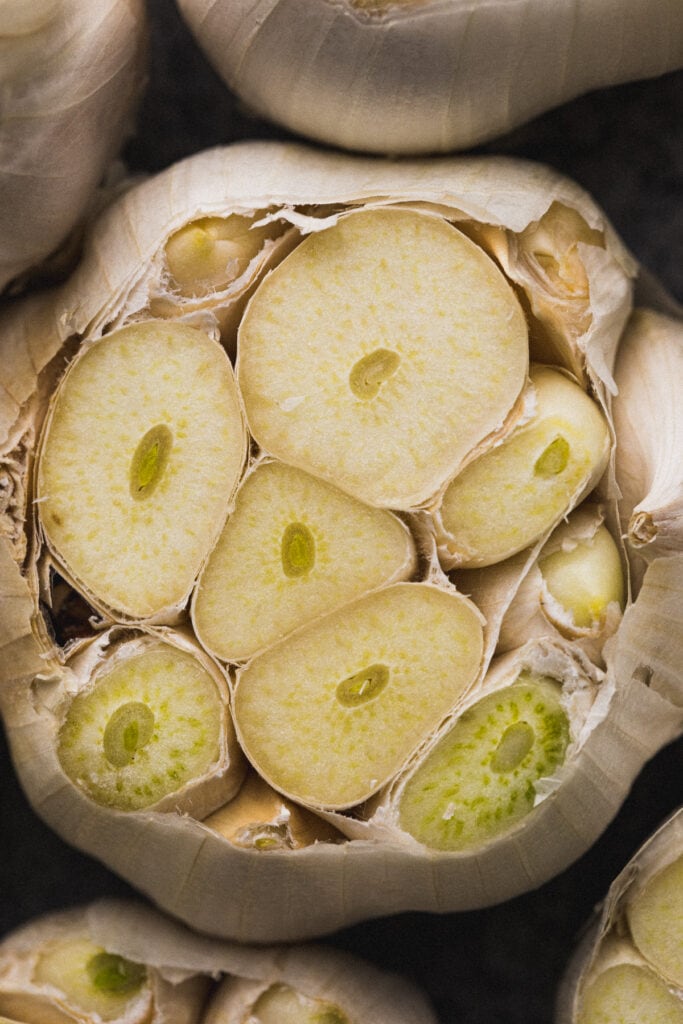 Closeup of exposed garlic cloves.