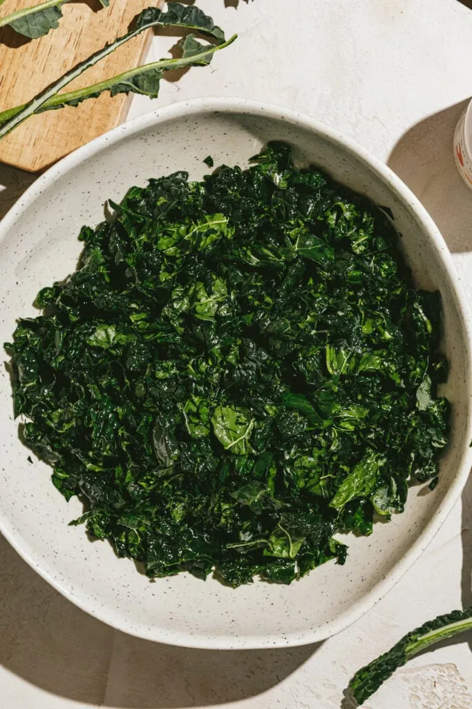 Kale leaves in a bowl for making Tuscan kale salad.