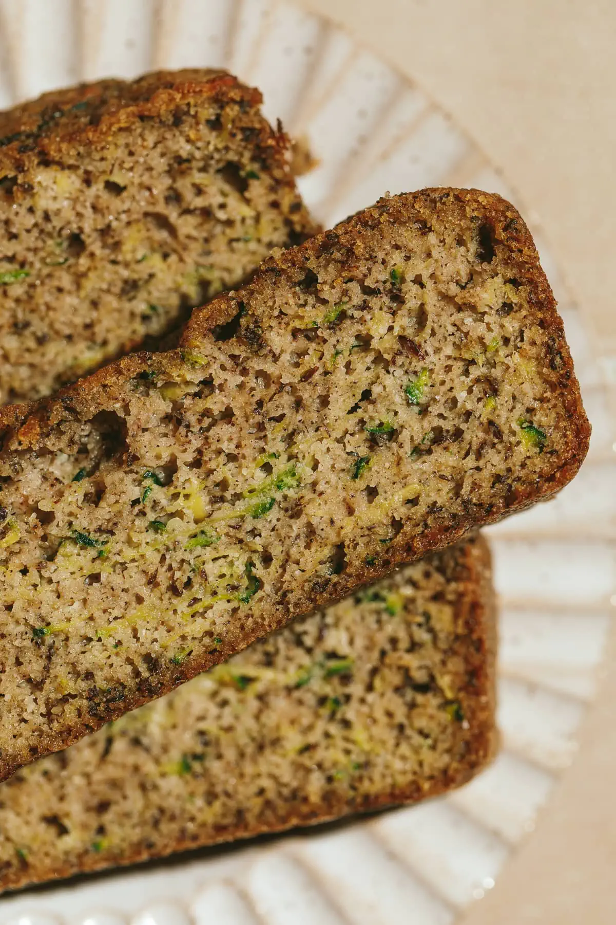 Closeup of the texture of a slice of keto zucchini bread.