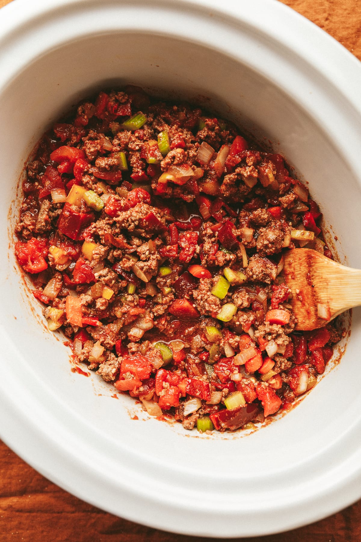 Cooked meat and chili mixture in a Crockpot.