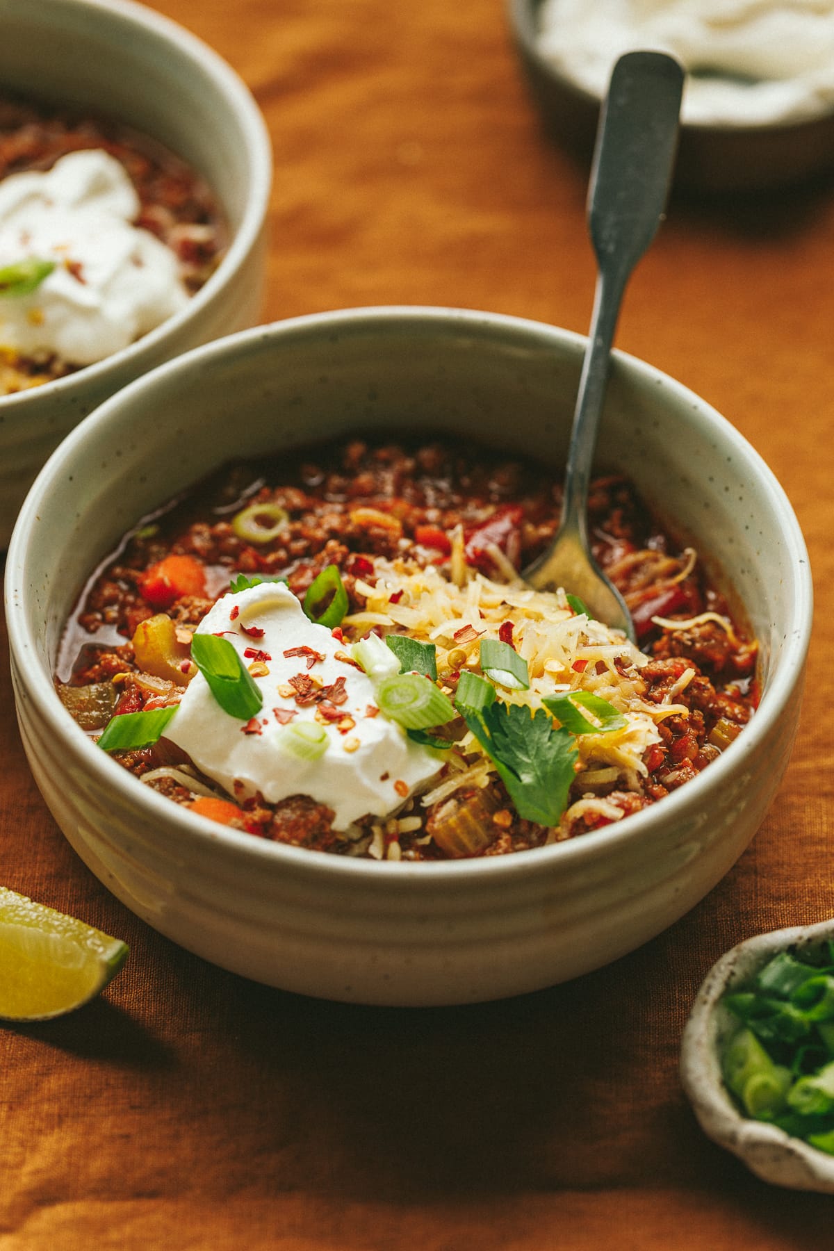 Bowl of crockpot no bean chili with toppings.