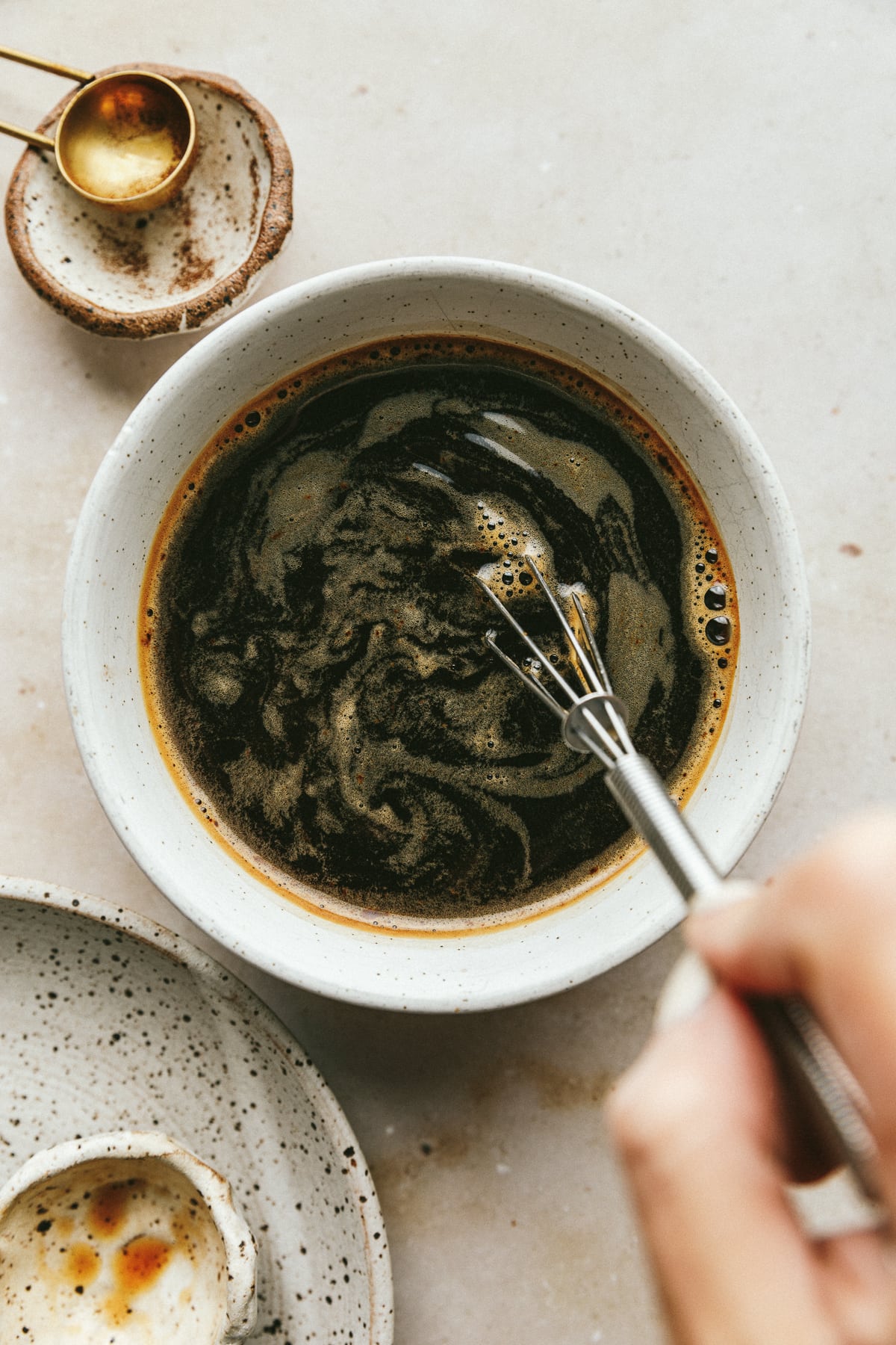 Whisking together coffee mixture for sugar-free tiramisu recipe.