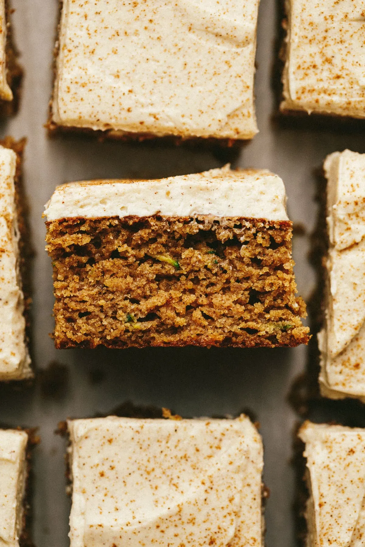 A slice of keto spice cake with a closeup of the texture.