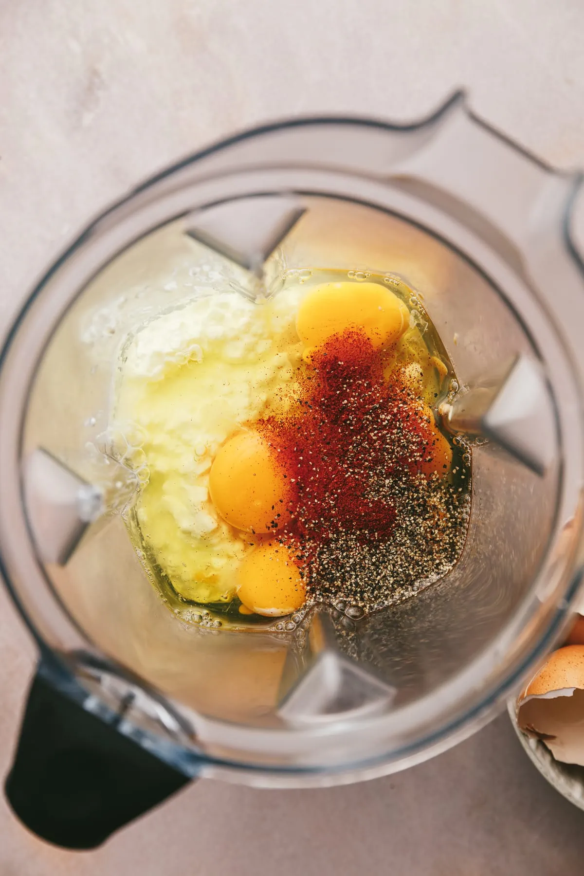 Ingredients in a blender for crustless cottage cheese quiche.