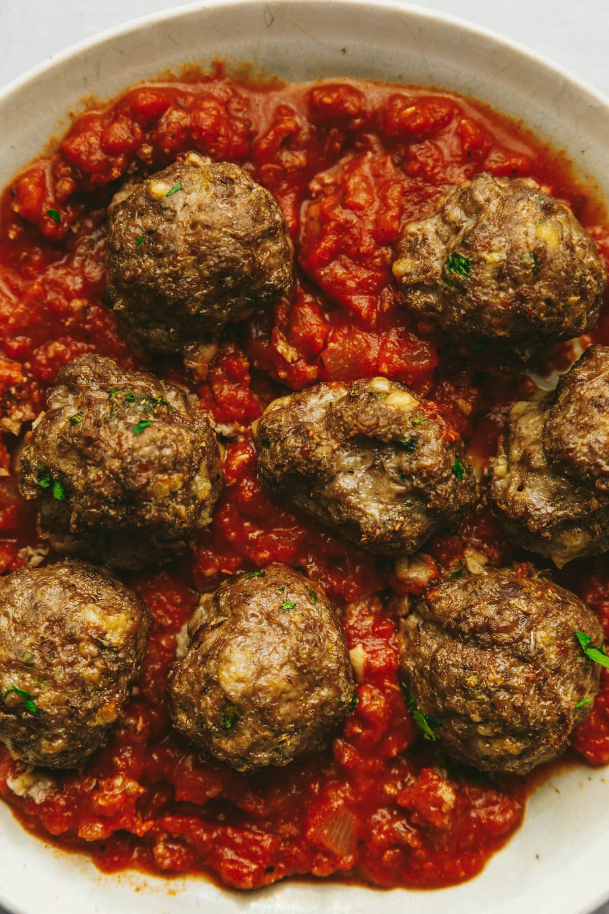 Keto italian meatballs in a red sauce.