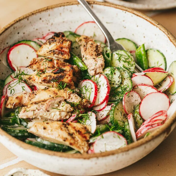 Closeup of radish cucumber salad with loads of fresh dill.