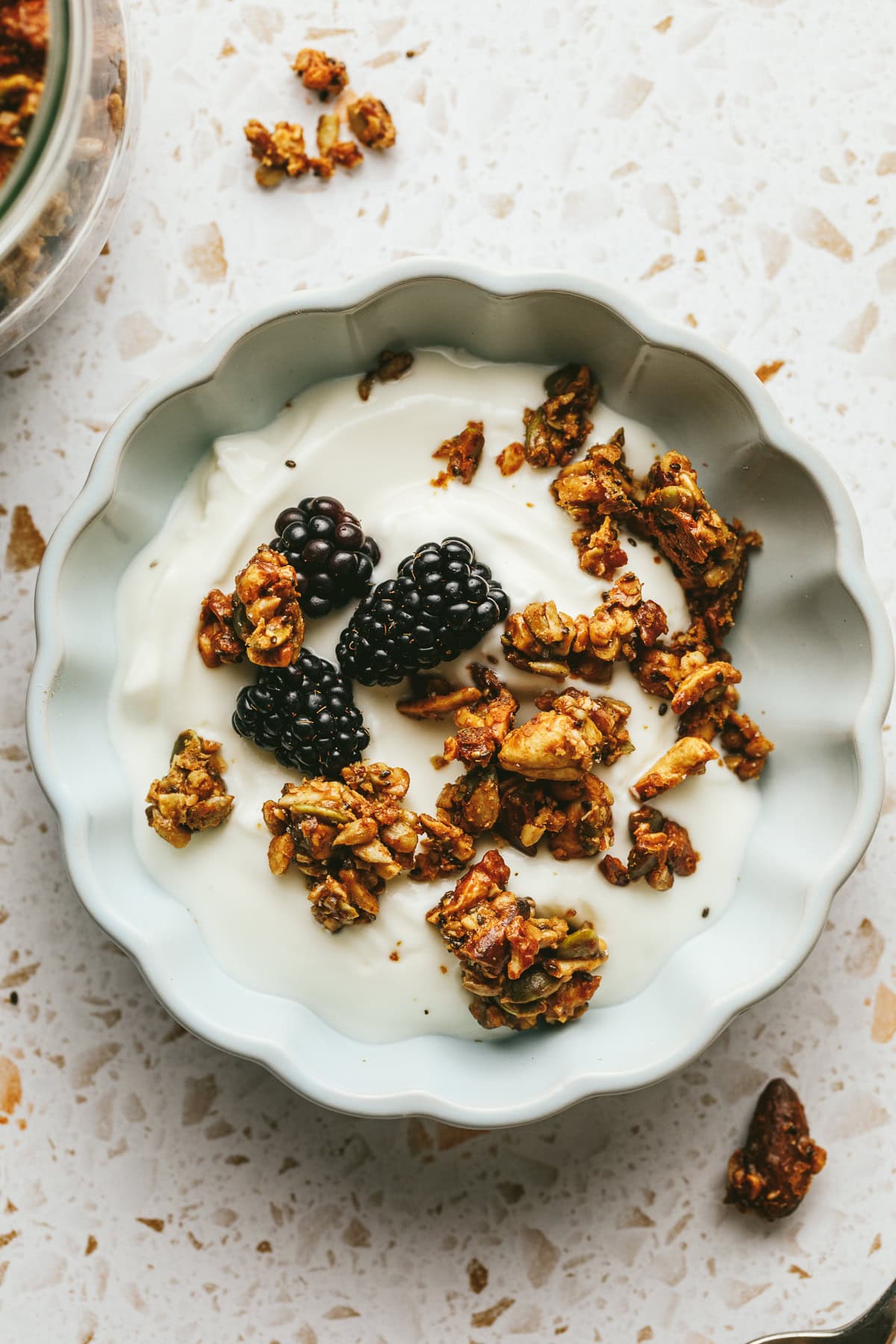 Overhead of a dish with yogurt and grain-free granola.