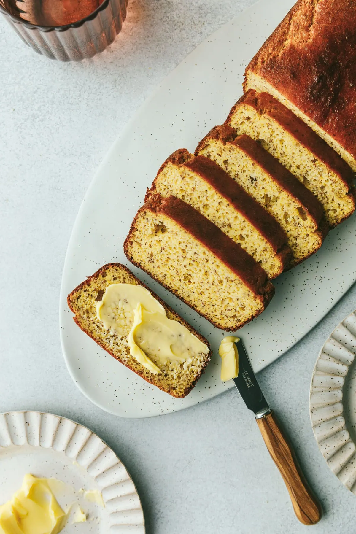 A loaf of high protein almond and lupin flour bread with butter.
