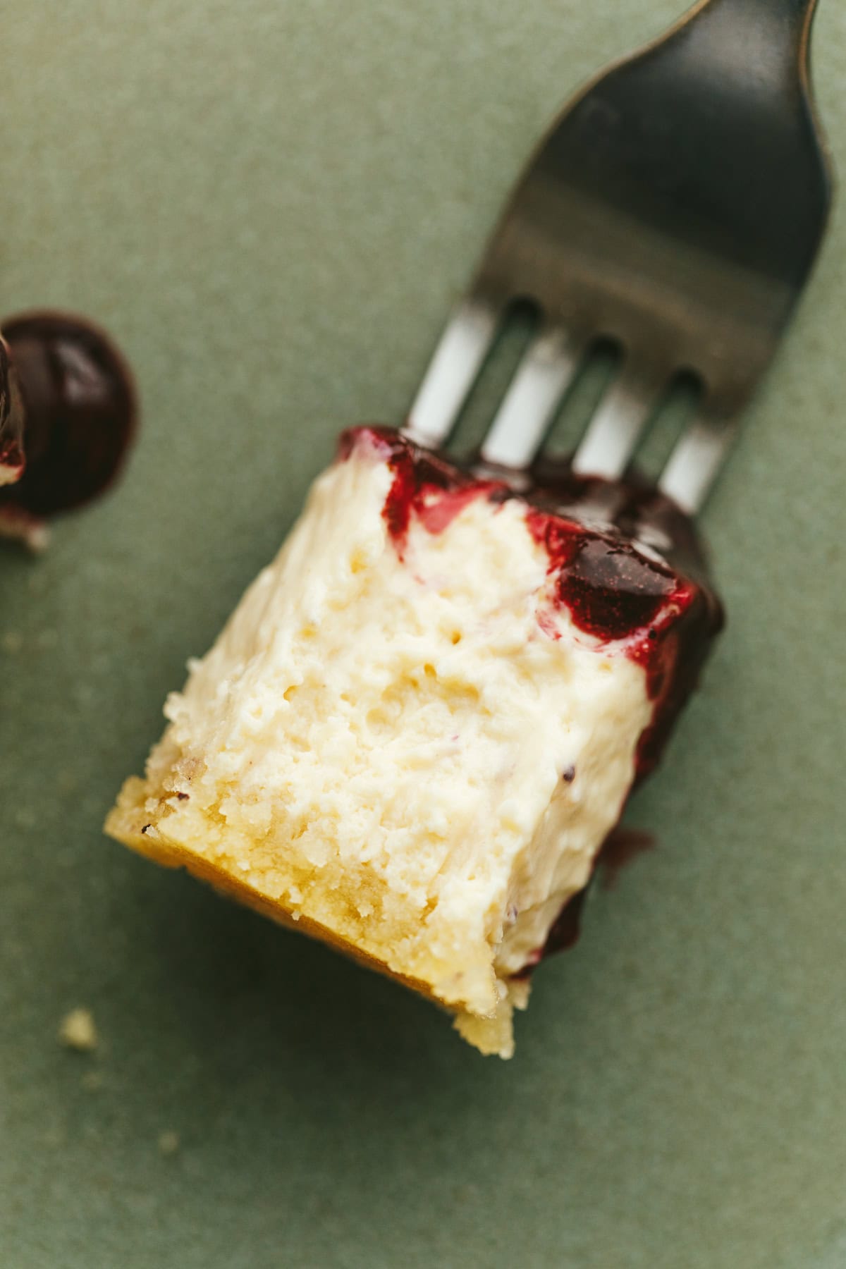 A bite of high protein cheescake on a fork.