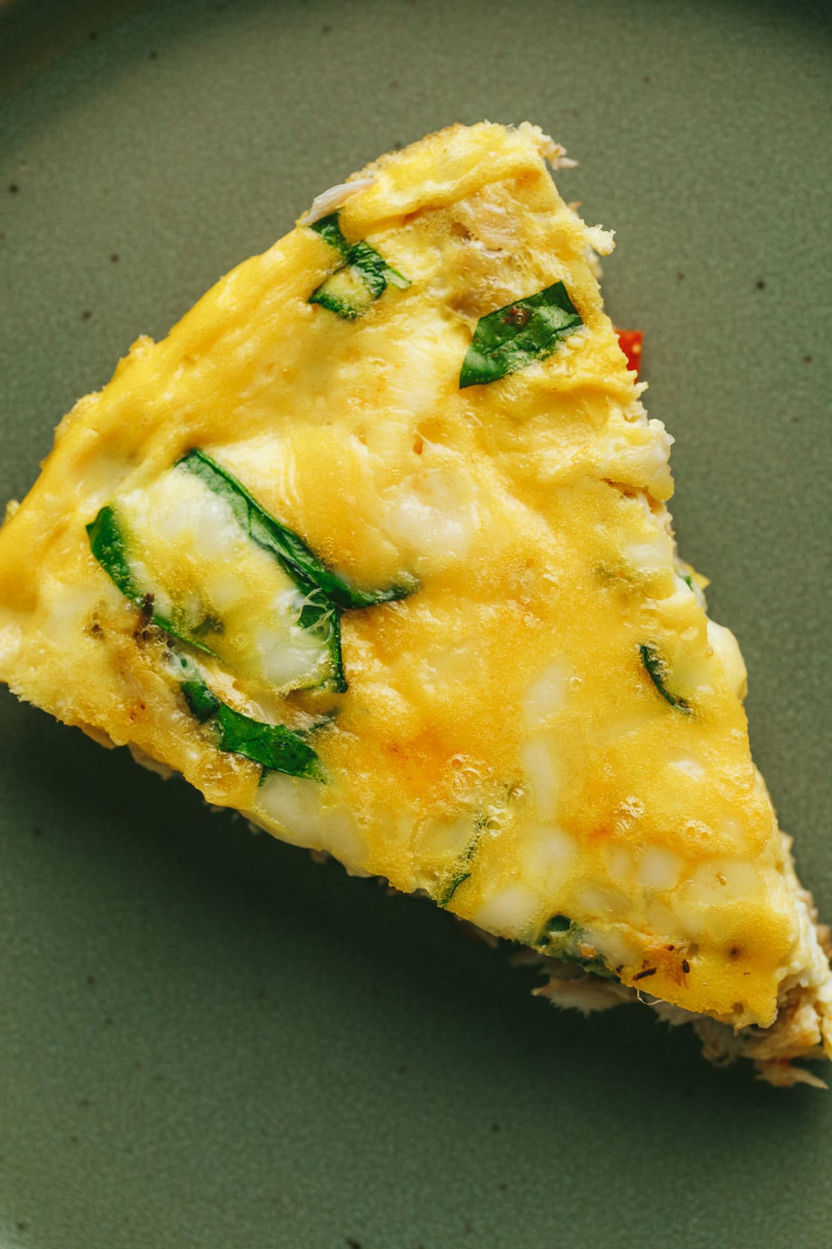 Closeup of the top of a piece of crab frittata.