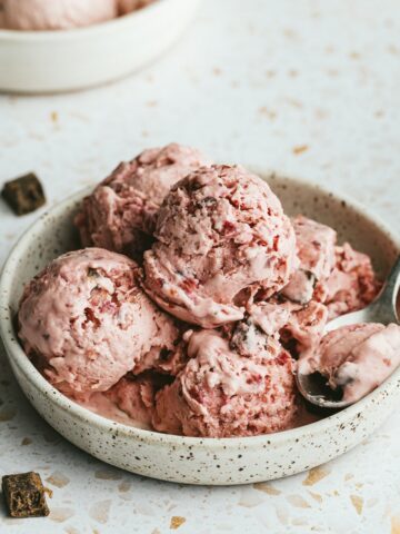 Keto cottage cheese ice cream in a bowl with a spoon.