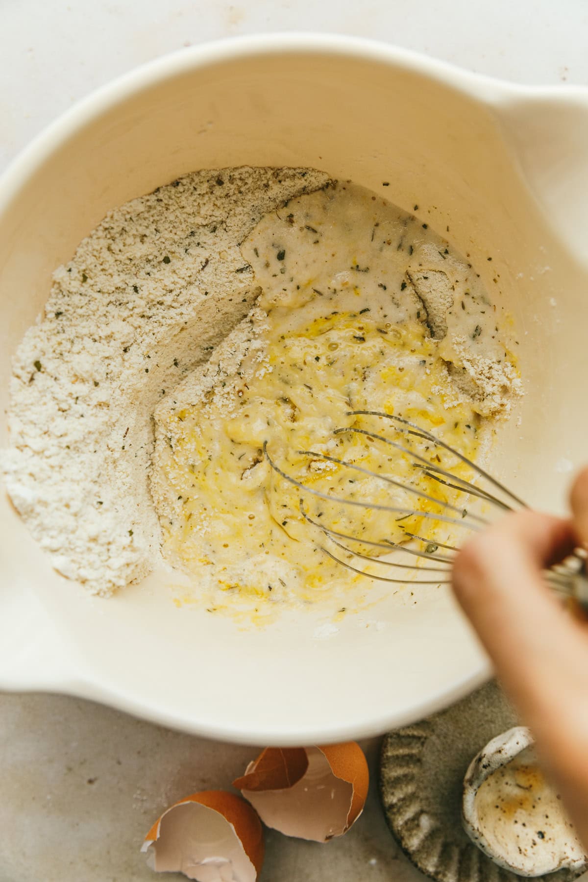 Whisking in the wet ingredients for grain-free pizza crust.