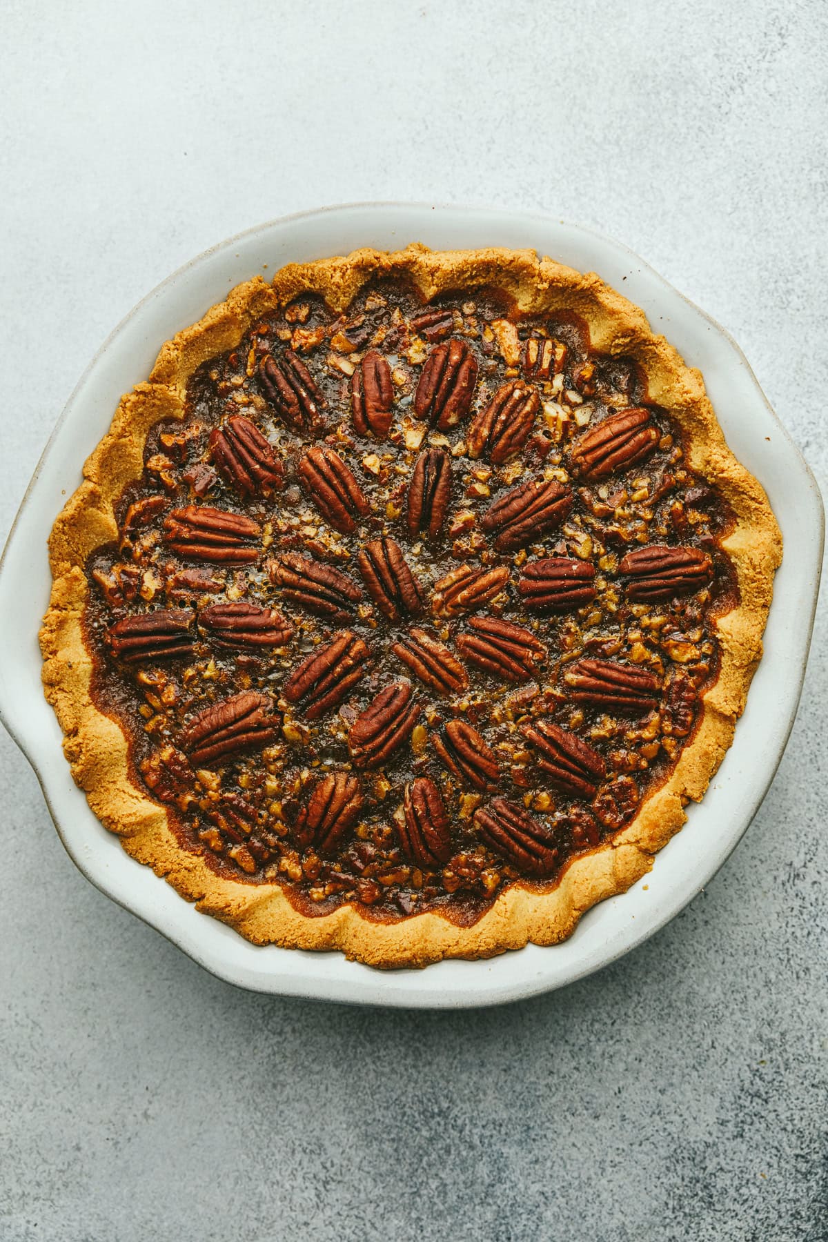 A baked keto pecan pie ready for slicing.