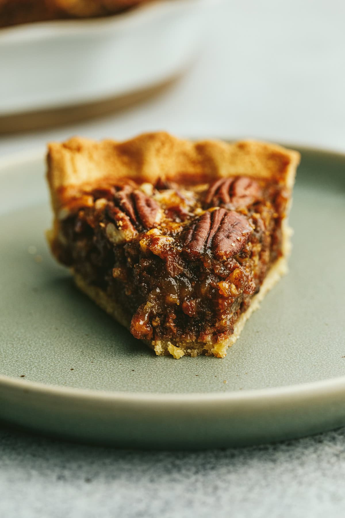 Closeup of the gooey texture of keto pecan pie.