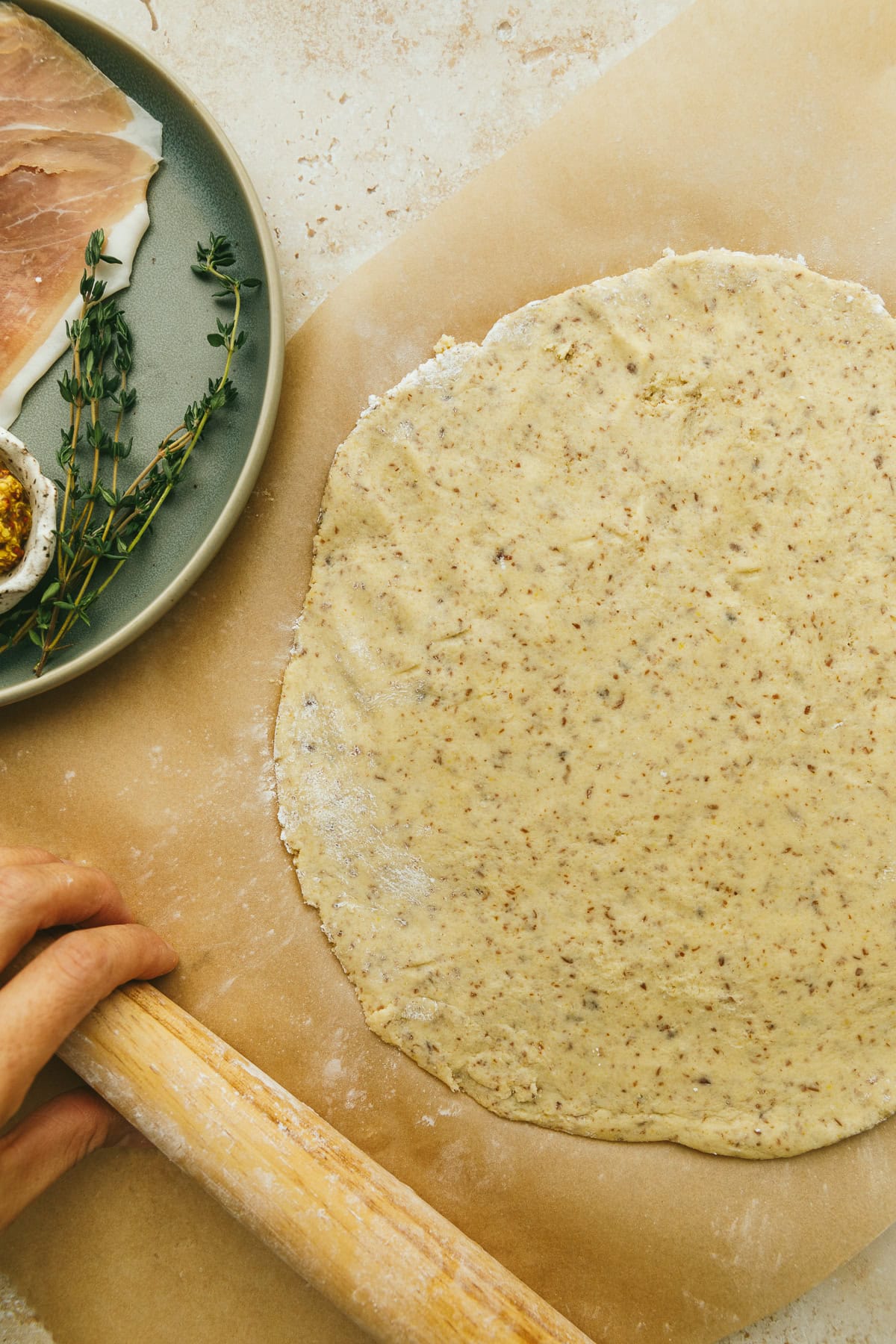 Rolling out the dough for flatbread.