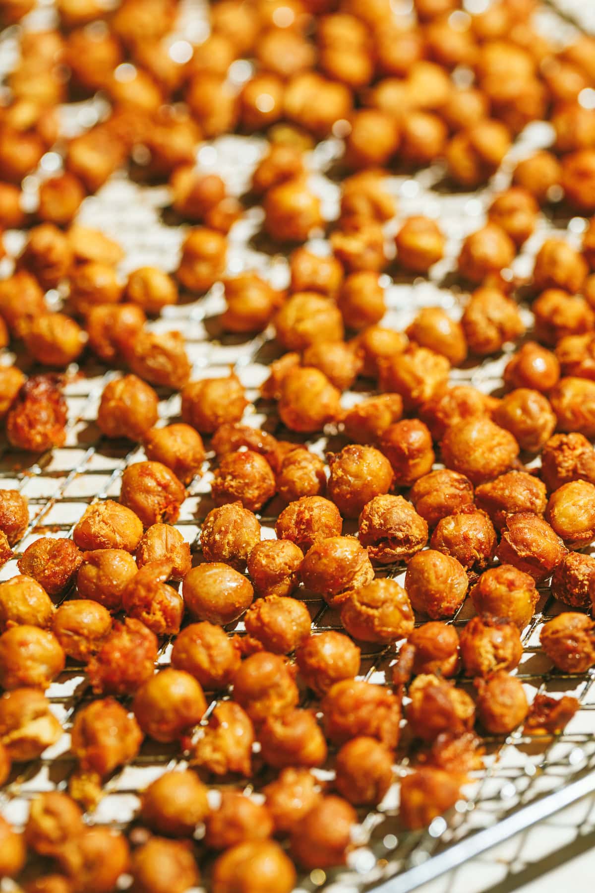 Air fryer chickpeas on an air fryer rack after cooking.