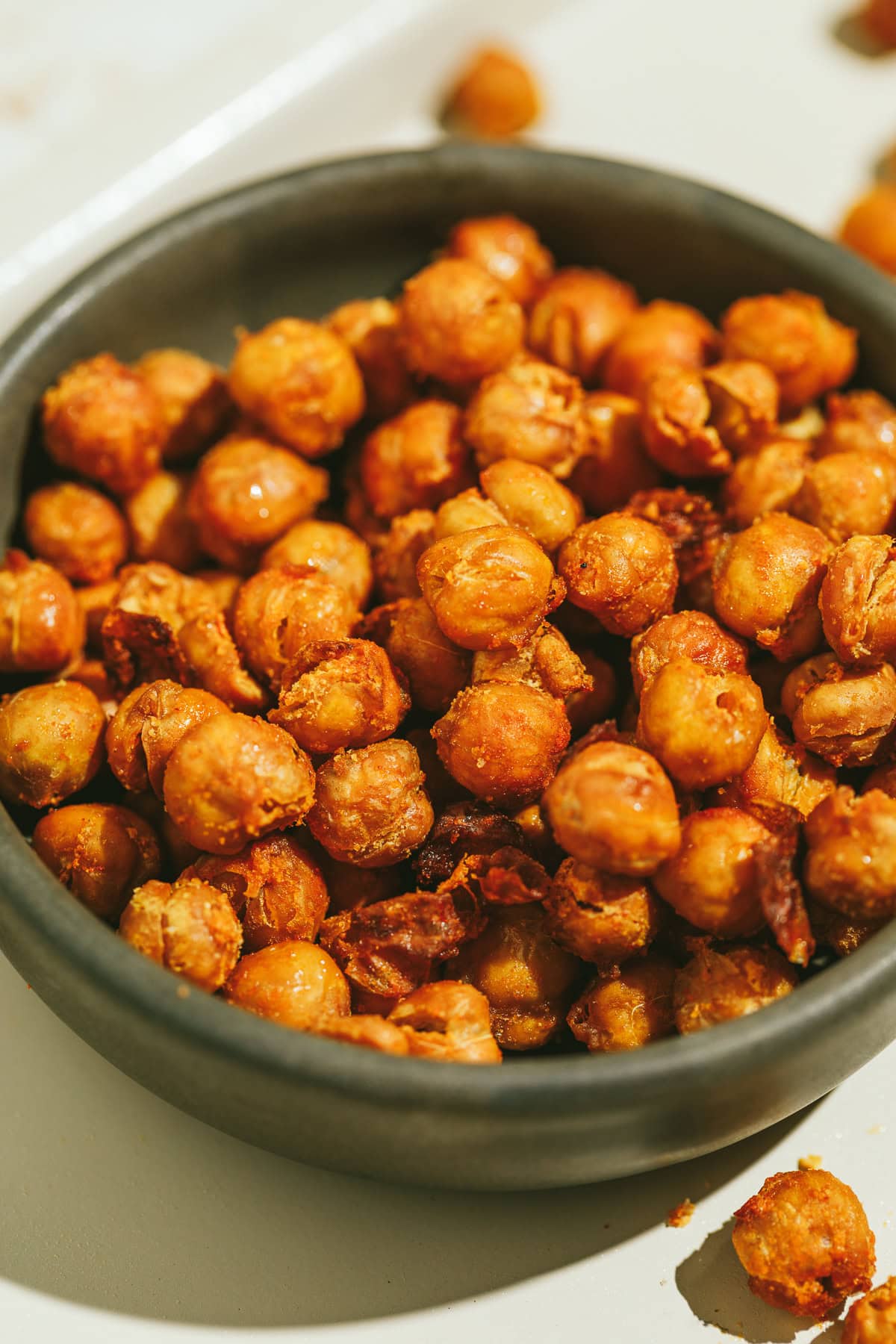 Crispy air fryer chickpeas in a brown dish.