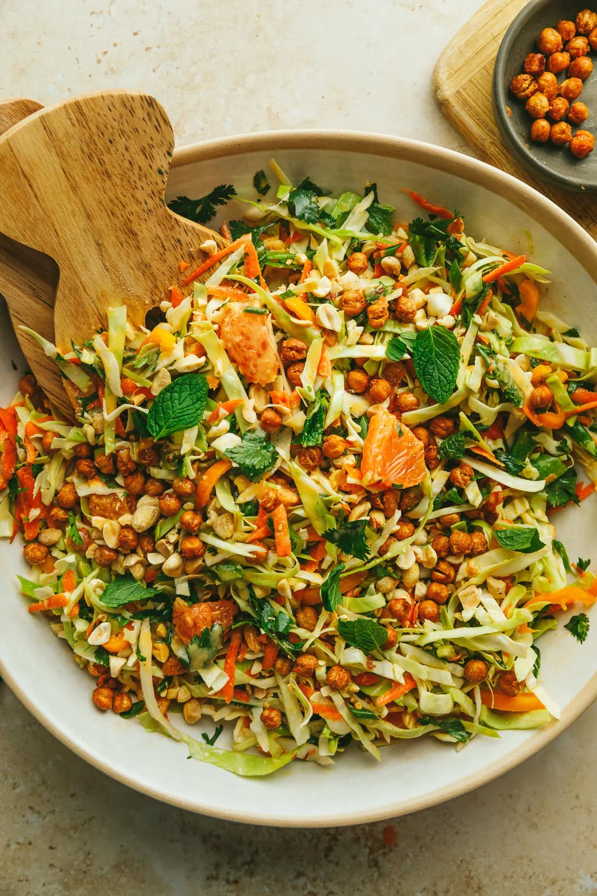 Cabbage crunch salad in a white serving bowl.