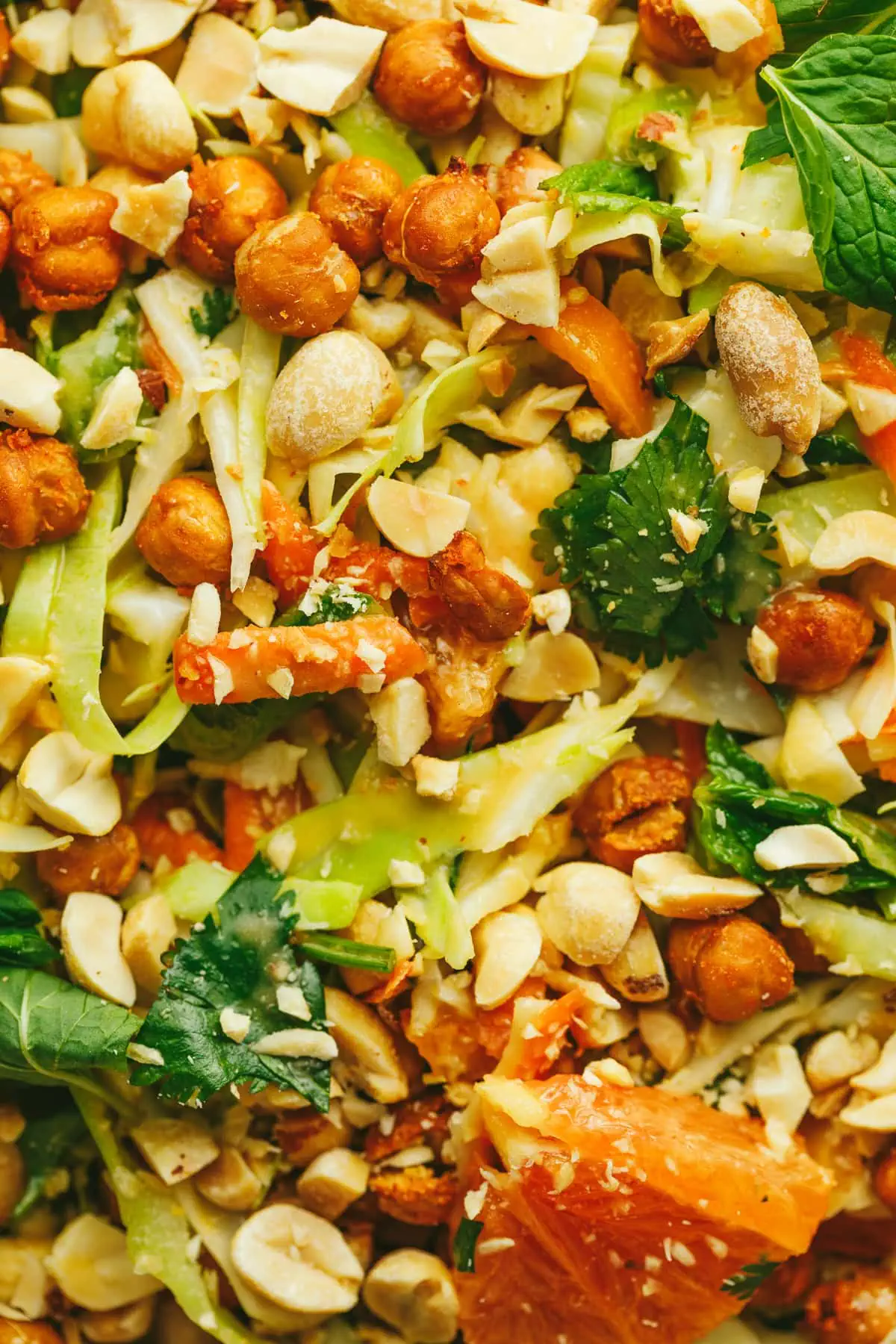 Closeup of cabbage crunch salad with crispy chickpeas, peanuts, and cabbage.