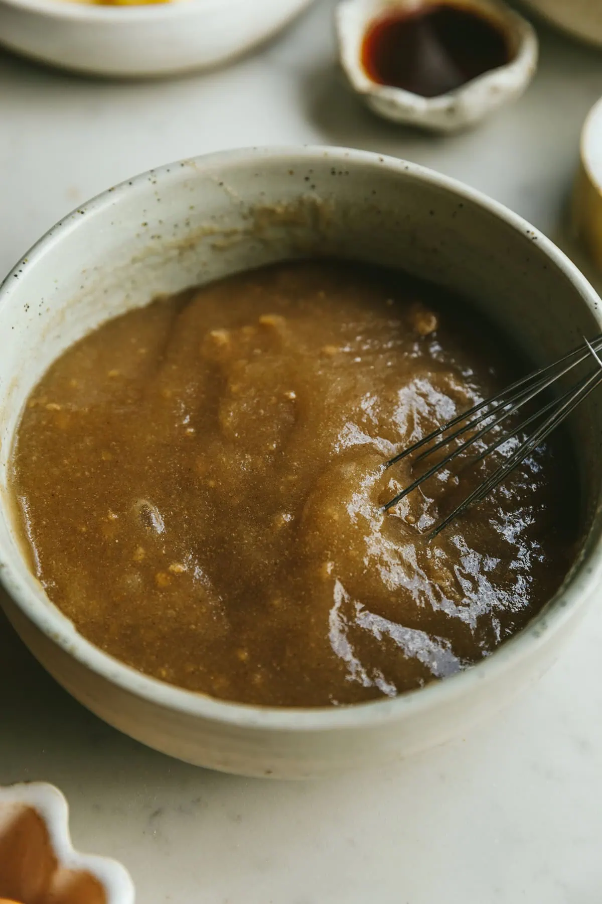 Psyllium husk gel in a bowl with a whisk.