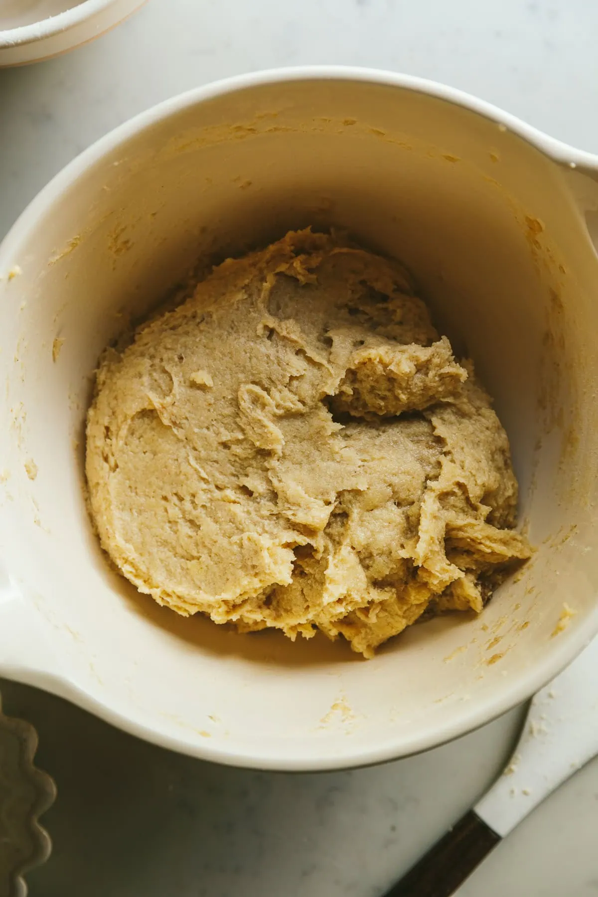 Keto cinnamon roll dough in a bowl before chilling.
