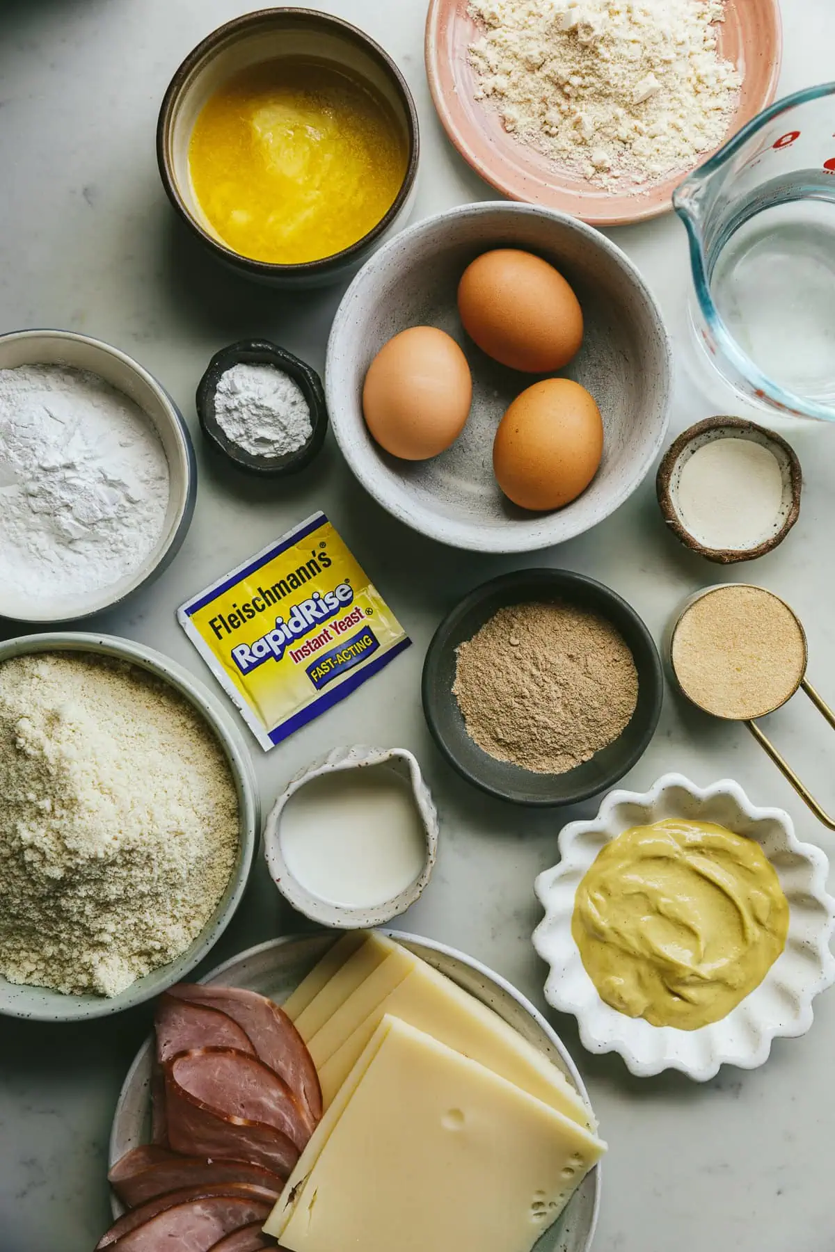 Ingredients for keto pinwheels on a white countertop.
