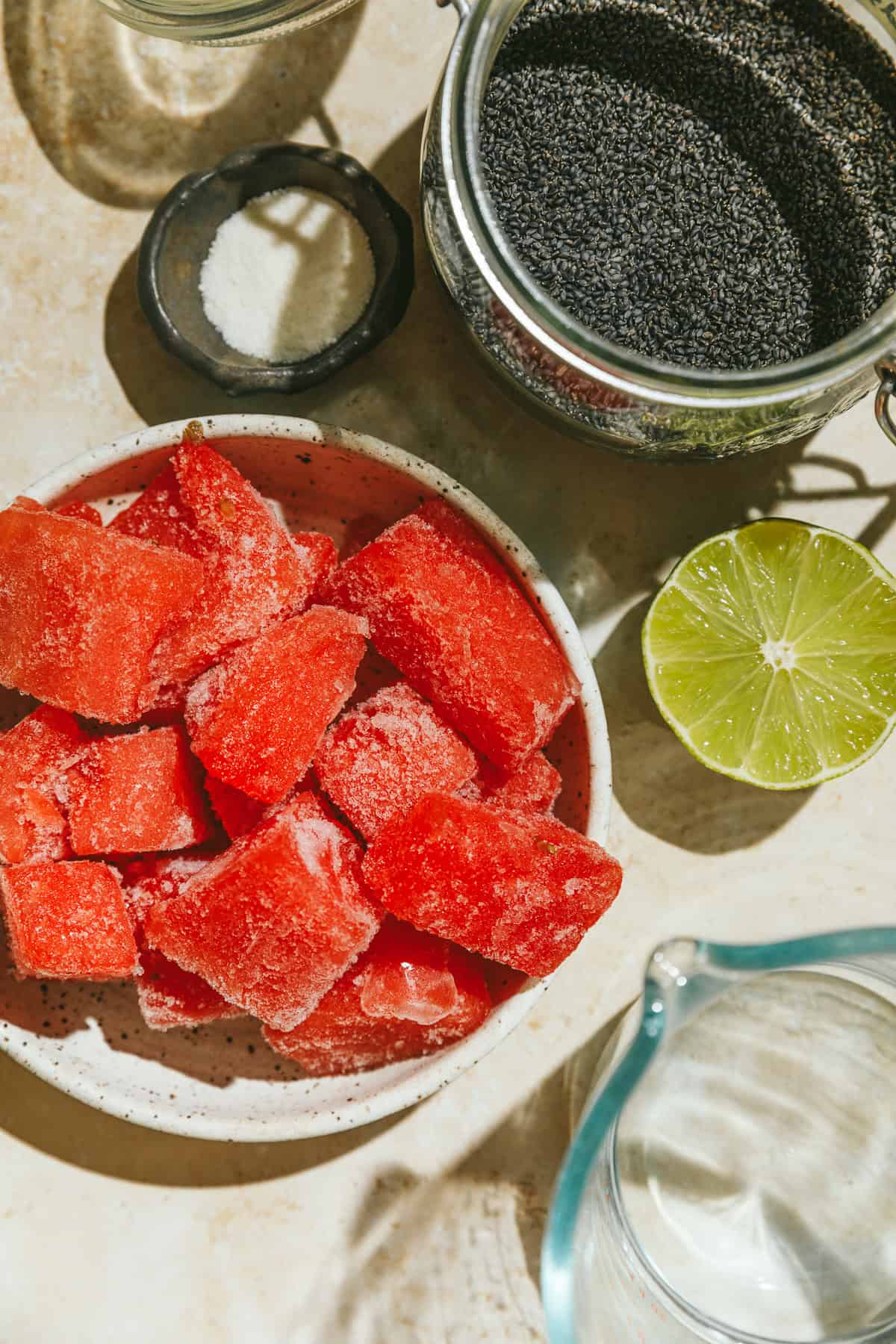 Ingredients for watermelon limeade slushie with basil seeds.